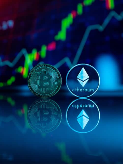 Bitcoin and Ethereum coins with market chart background, digital currency investment concept.