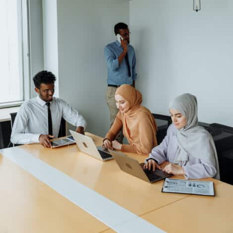 Diverse team collaborating in a modern office setting for careers at ENIXEN Group.