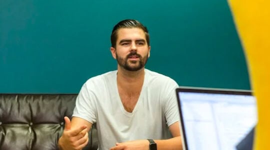 Business professional in a meeting at ENIXEN Group office.
