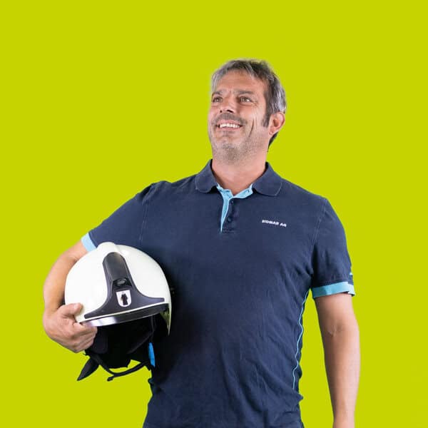 Enixen Group professional holding a helmet, showcasing safety and engineering expertise.